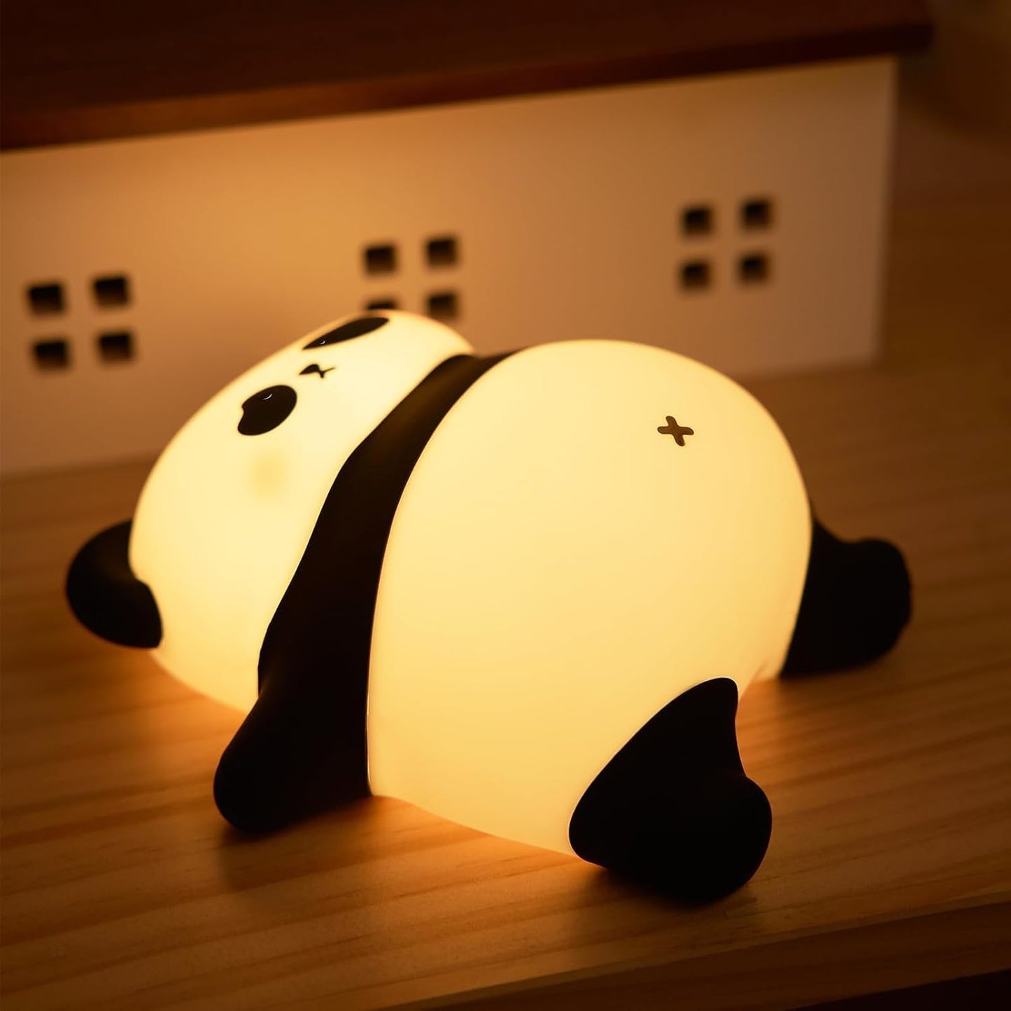 Tired and lazy panda night light creating sleeping envoirnment with warm glow.