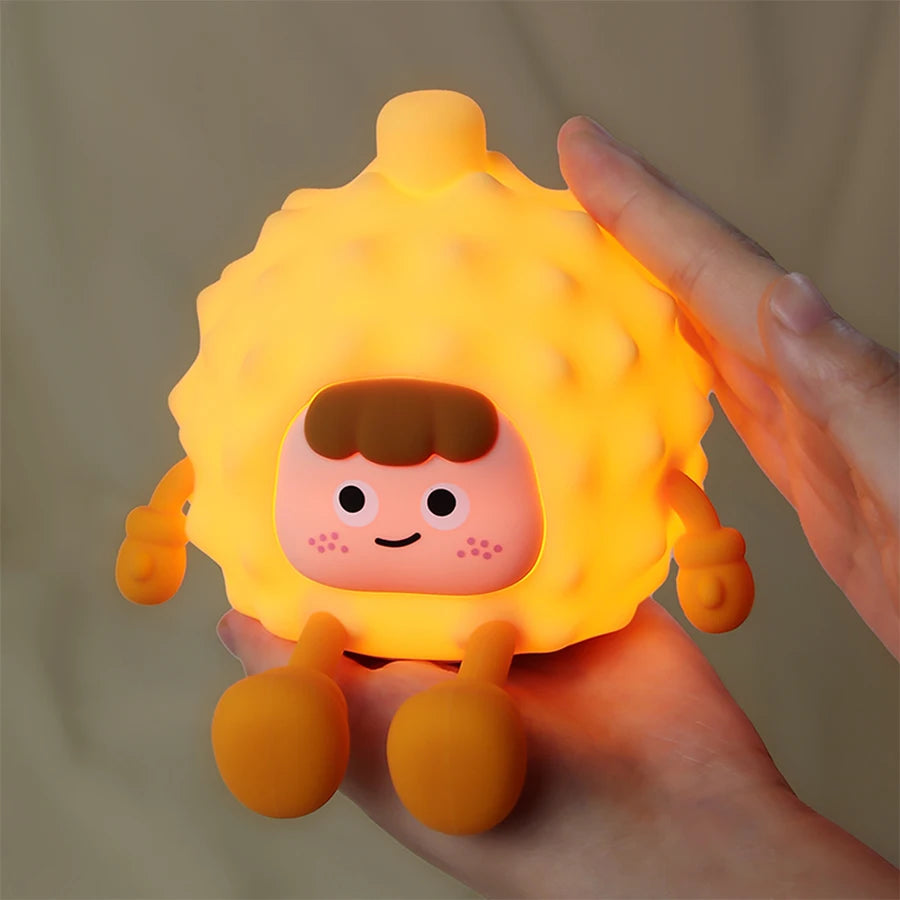 Luminous toy shaped corn with a cartoon face, light level can be adjusted by tapping.