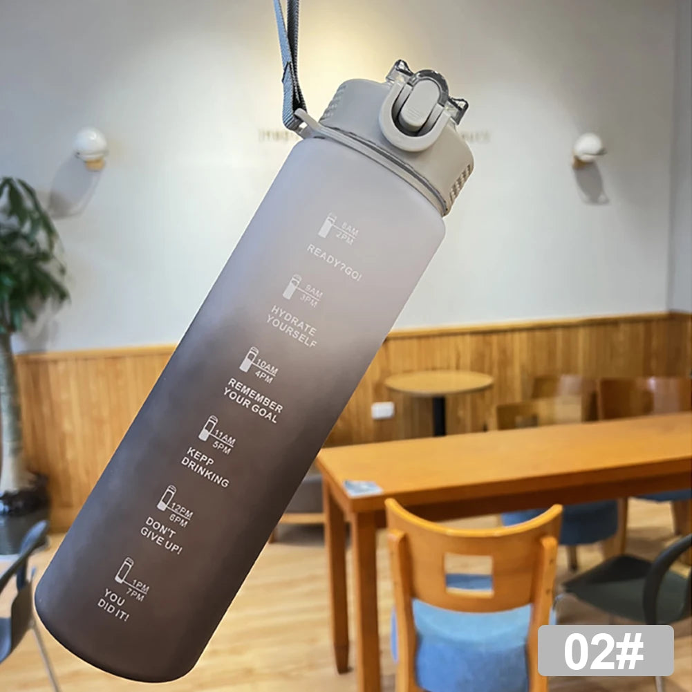 Sport water bottle with scale markings to track daily water intake,  with one-handed lid operation and carrying cord.