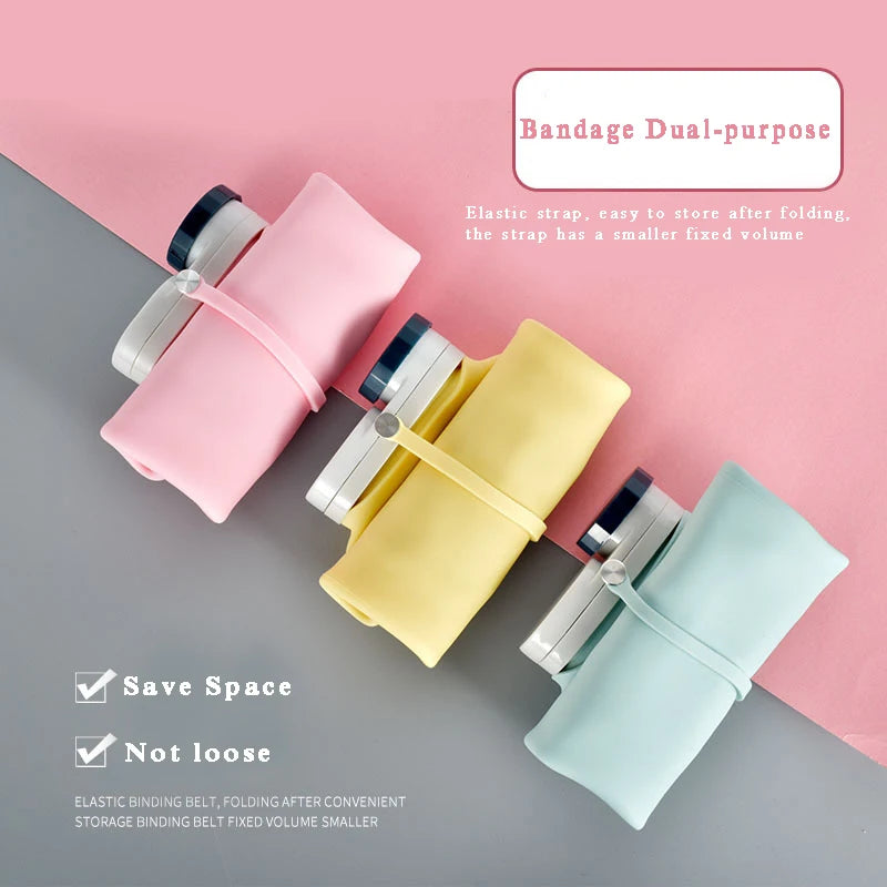 Collapsible silicone water bottle in pink, folded for compact storage.