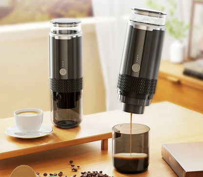 Compact portable coffee maker brewing espresso at a campsite