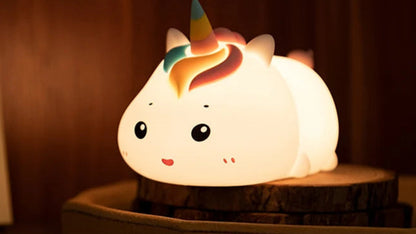 sleeping Unicorn-shaped night light with adjustable brightness levels.